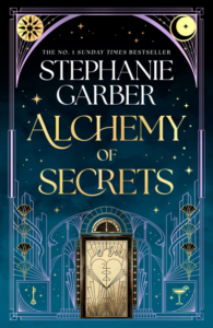 Cover of Alchemy of Secrets by Stephanie Garber, a highly anticipated title featured in October 2025 Romance and Fantasy Book Releases. The design shows an ornate golden doorway with celestial stars, moons, and art deco patterns on a deep teal background.