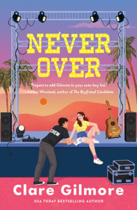 Cover of Never Over by Clare Gilmore. The illustrated design shows a woman sitting on the edge of a concert stage at sunset, smiling as a crew member hands her papers. A guitar rests against the stage, with palm trees and desert mountains in the background, and the bold yellow title glows like marquee lights.